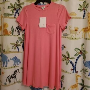 Girls dress 68% polyester, 28% rayon, 4% spandex. Pit to pit 15 inches, length27
